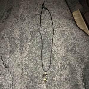 Mood stone necklace set on dolphin tail